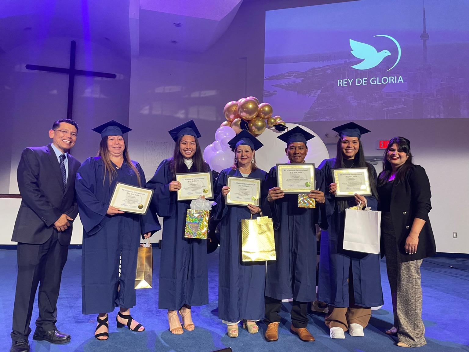 ACADI students receiving certificates and recognition gifts.